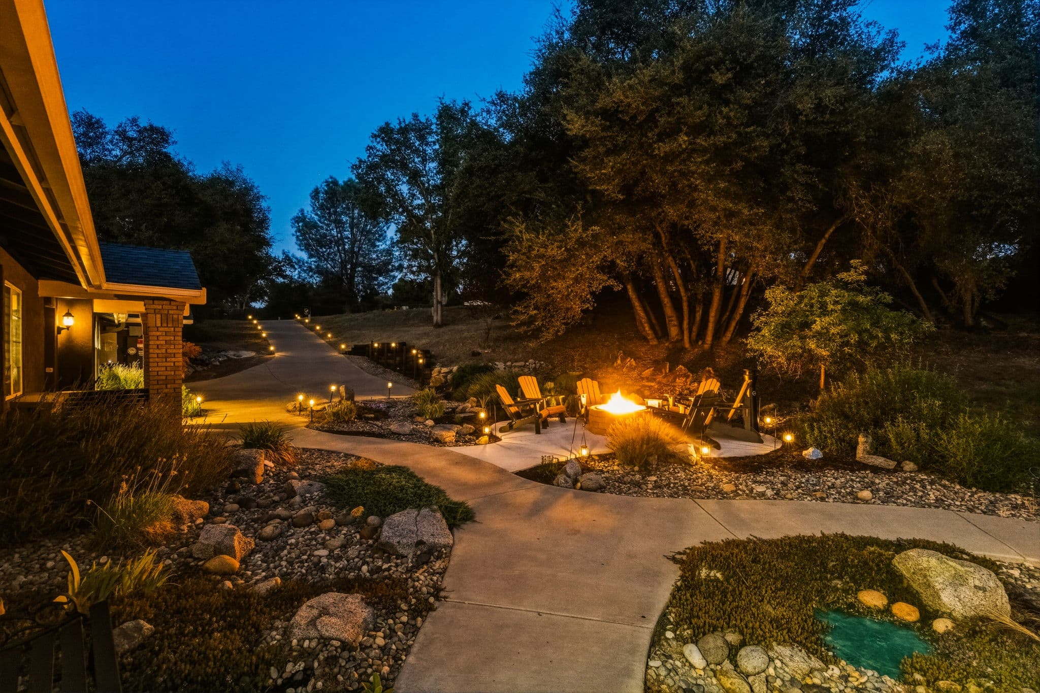 Built-in propane firepit glowing at night